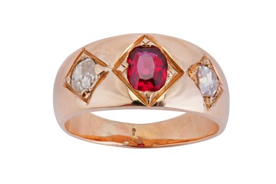 Lot 97 - A three stone ruby and diamond ring