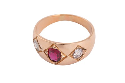 Lot 97 - A three stone ruby and diamond ring