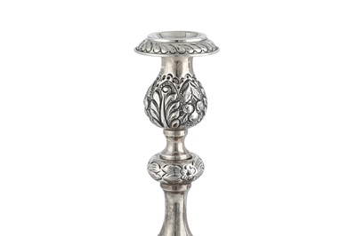 Lot 338 - Judaica - A pair of George V sterling silver sabbath candlesticks, London 1911 by Jacob Rosenzweig & Aaron Taitelbaum