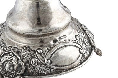 Lot 338 - Judaica - A pair of George V sterling silver sabbath candlesticks, London 1911 by Jacob Rosenzweig & Aaron Taitelbaum