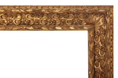 Lot 32 - AN ITALIAN 17TH CENTURY STYLE CARVED AND GILDED CASSETTA FRAME WITH CARVED AND PIERCED INLAY
