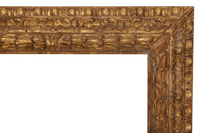 Lot 30 - AN ITALIAN 17TH CENTURY BOLOGNESE STYLE CARVED AND GILDED REVERSE PROFILE FRAME