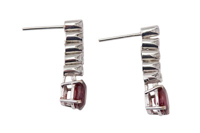 Lot 101 - A pair of ruby and diamond pendent earrings