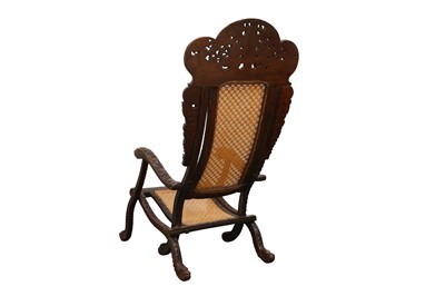 Lot 395 - AN ANGLO-INDIAN CARVED HARDWOOD FOLDING CHAIR