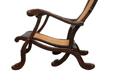 Lot 259 - AN ANGLO-INDIAN CARVED HARDWOOD FOLDING CHAIR
