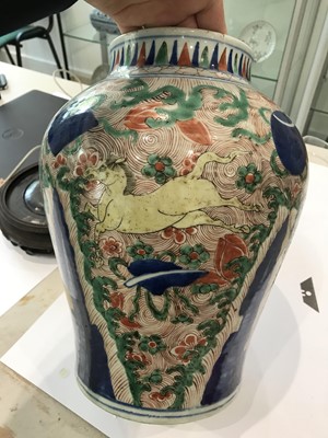 Lot 225 - A NEAR-PAIR OF CHINESE WUCAI BALUSTER 'HORSES' VASES AND COVERS.