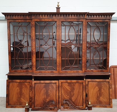 Lot 33 - A LARGE GEORGE III STYLE FLAME MAHOGANY BREAKFRONT BOOKCASE, LATE 20TH CENTURY