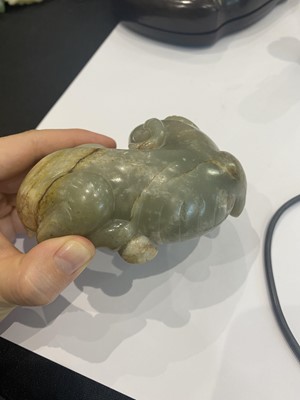 Lot 329 - A CHINESE PALE CELADON JADE CARVING OF A GOAT.