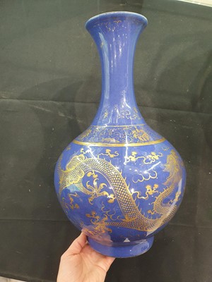 Lot 249 - A CHINESE POWDER-BLUE GILT-DECORATED 'DRAGON' BOTTLE VASE.