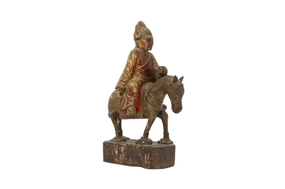 Lot 521 - A CHINESE GILT-LACQUER WOOD FIGURE OF A HORSERIDER.