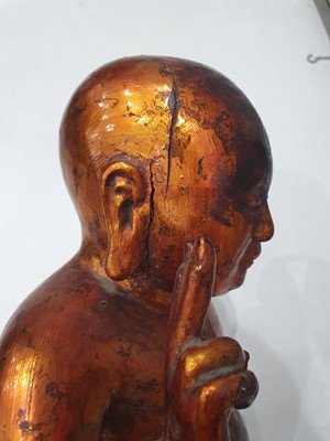 Lot 526 - A CHINESE GILT-LACQUER FIGURE OF THE INFANT BUDDHA.
