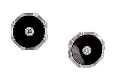 Lot 58 - A pair of onyx and diamond earstuds