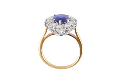 Lot 74 - A sapphire and diamond cluster ring