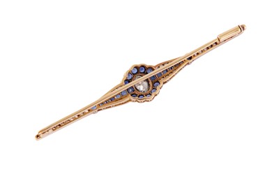 Lot 38 - A diamond and sapphire bar brooch