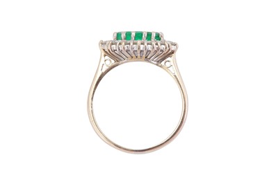 Lot 54 - An emerald and diamond cluster ring