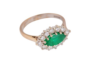 Lot 54 - An emerald and diamond cluster ring