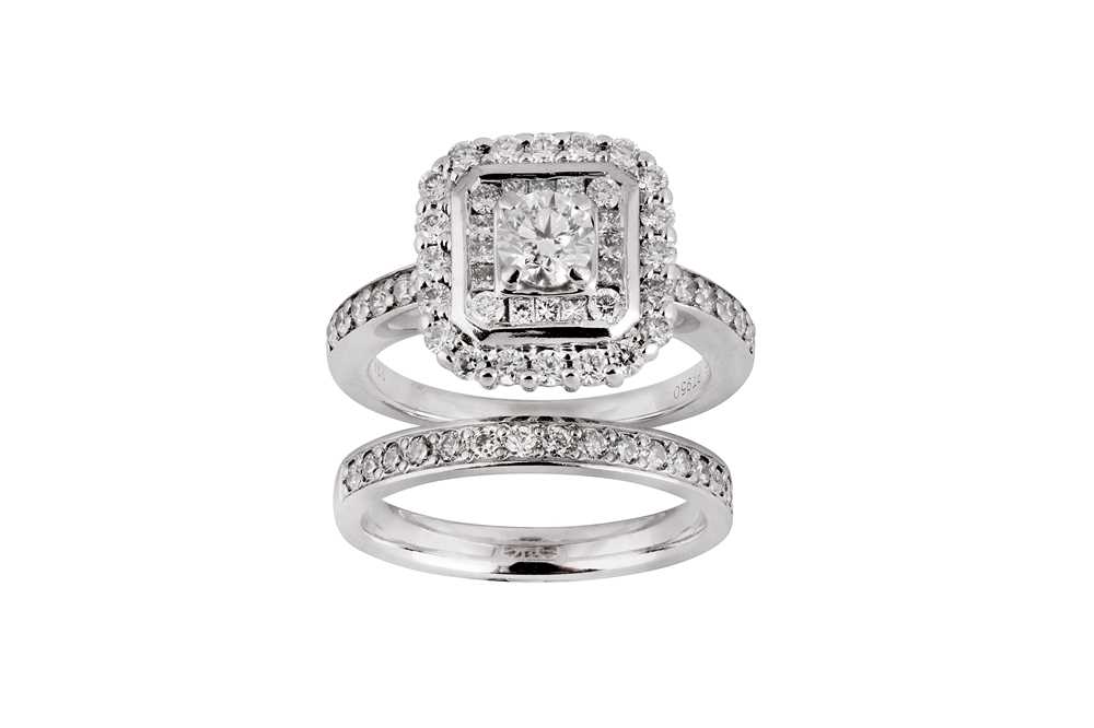 Lot 211 - A diamond and platinum engagement ring and