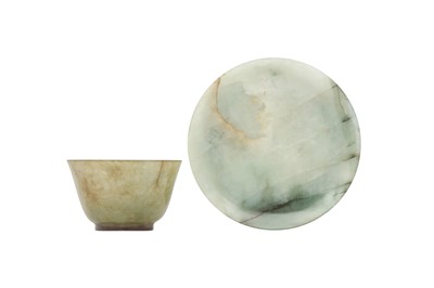 Lot 481 - A CHINESE CELADON JADE CUP AND SAUCER