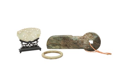 Lot 318 - A CHINESE PALE CELADON JADE CHIME, A BANGLE AND A COIN CARVING.