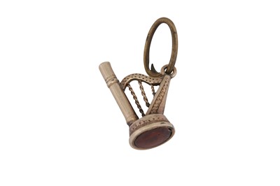 Lot 88 - A 19TH CENTURY WATCH KEY FOB IN THE FORM OF A HARP
