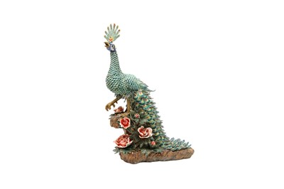 Lot 698 - A CHINESE FAMILLE ROSE MODEL OF A PEACOCK.