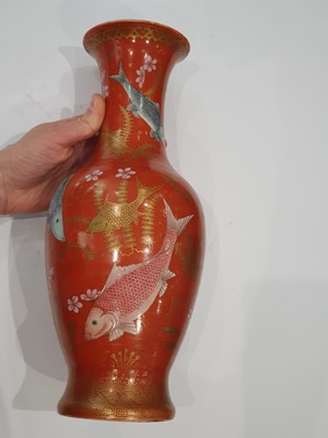 Lot 326 - A CHINESE GILT-DECORATED SALMON-RED 'FISH' VASE.