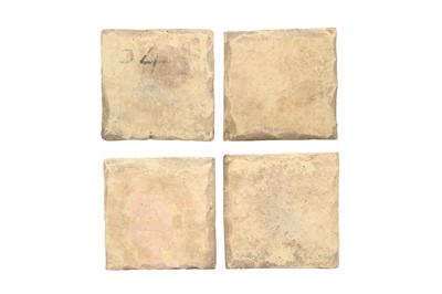 Lot 412 - FOUR SAFAVID CUERDA SECA POTTERY TILES WITH FLORAL SPRAYS