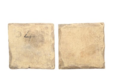 Lot 412 - FOUR SAFAVID CUERDA SECA POTTERY TILES WITH FLORAL SPRAYS