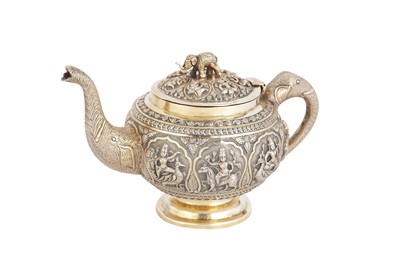 Lot 118 - A late 19th century Anglo – Indian parcel gilt silver teapot and twin handled sugar bowl, Madras circa 1880