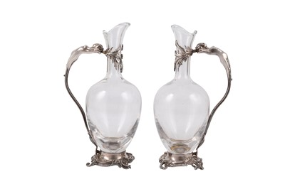 Lot 85 - A PAIR OF EARLY 20TH CENTURY FRENCH SILVER PLATED EWERS BY HENIN & CIE, PARIS