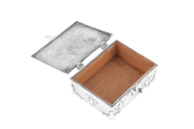 Lot 437 - An Edwardian ‘Arts and Crafts’ sterling silver cigarette box, Birmingham 1903 by John William Barrett