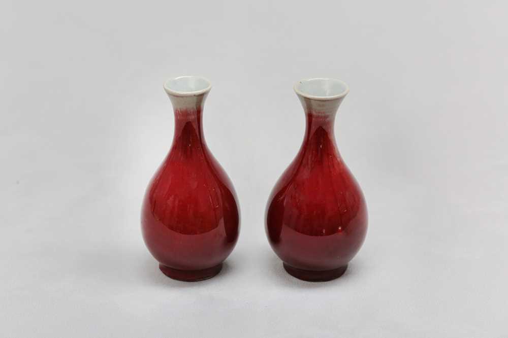 Lot 81 - A PAIR OF CHINESE COPPER RED-GLAZED VASES.