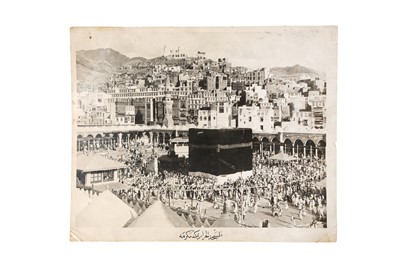 Lot 444 - A GROUP OF HAJJ-RELATED SOUVENIRS AND A TRAVEL POSTCARDS ALBUM