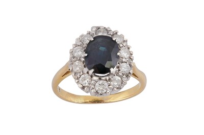 Lot 76 - A sapphire and diamond cluster ring