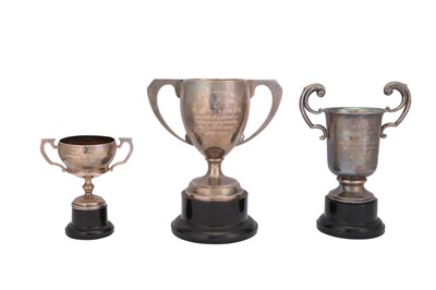 Lot 179 - A MIXED GROUP OF GEORGE V STERLING SILVER TWIN HANDLED TROPHY CUPS