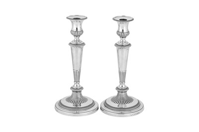 Lot 605 - A pair of George III sterling silver candlesticks, Sheffield 1812 by John Roberts & Co