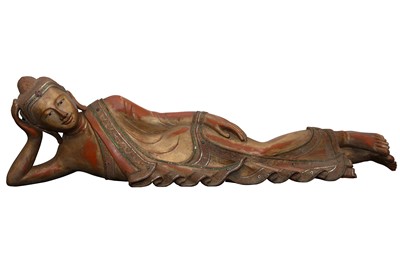 Lot 453 - A CARVED FIGURE OF A RECUMBENT BUDDHA, 19TH CENTURY