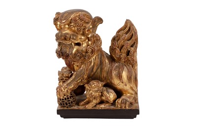 Lot 611 - A CARVED GILTWOOD DOG OF FO, 20TH CENTURY