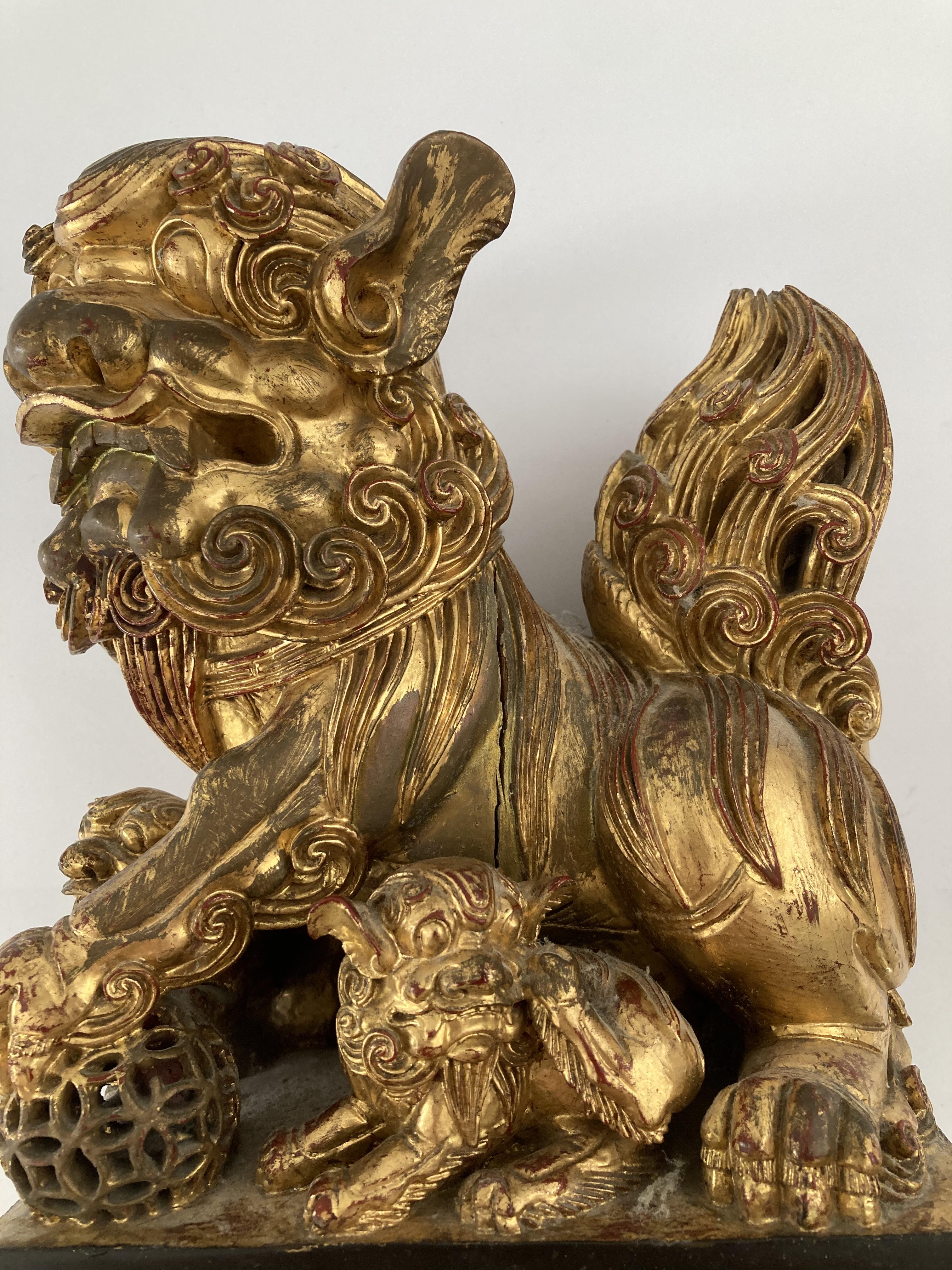 Lot 611 - A CARVED GILTWOOD DOG OF FO, 20TH CENTURY