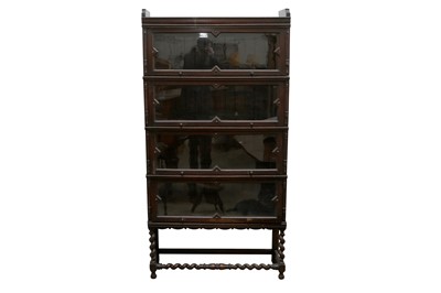 Lot 161 - A MEOVOTO 'B12 1/4' JACOBEAN STYLE OAK SECTIONAL BOOKCASE, EARLY 20TH CENTURY