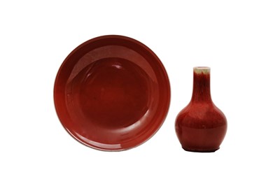 Lot 80 - A CHINESE COPPER RED-GLAZED BOTTLE VASE AND DISH.