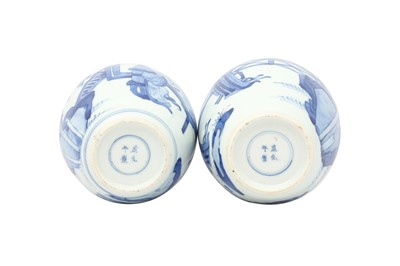 Lot 236 - TWO CHINESE BLUE AND WHITE 'LADIES' JARS AND COVERS.