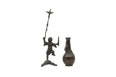 Lot 666 - A CHINESE BRONZE 'LIU HAI' CANDLE STICK AND A SMALL VASE.