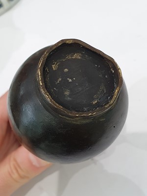 Lot 666 - A CHINESE BRONZE 'LIU HAI' CANDLE STICK AND A SMALL VASE.