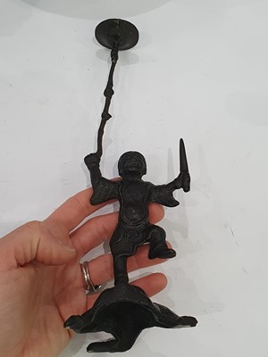 Lot 666 - A CHINESE BRONZE 'LIU HAI' CANDLE STICK AND A SMALL VASE.
