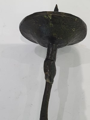 Lot 666 - A CHINESE BRONZE 'LIU HAI' CANDLE STICK AND A SMALL VASE.