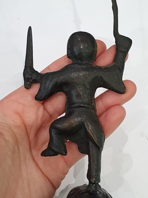 Lot 666 - A CHINESE BRONZE 'LIU HAI' CANDLE STICK AND A SMALL VASE.