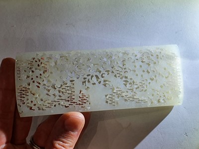 Lot 43 - A LARGE CHINESE WHITE JADE RETICULATED ‘BUTTERFLIES' PLAQUE.