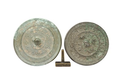 Lot 662 - TWO CHINESE BRONZE MIRRORS AND A BRONZE SEAL.