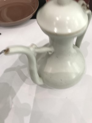Lot 62 - A CHINESE WHITE-GLAZED EWER AND COVER.